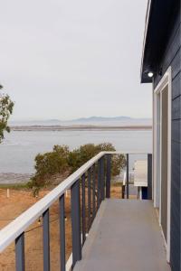 a balcony with a view of the water at Cabaña frente al mar in Coronel Esteban Cantú +8 photos