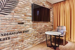 TV a/nebo společenská místnost v ubytování Hotel The Class + 37 fotografií