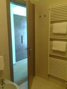 a bathroom with a shower and a sink and a mirror at Locanda del Lago Rosmunda in Clusane sul Lago +135 photos