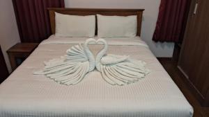 Ένα ή περισσότερα κρεβάτια σε δωμάτιο στο Villa Bella Hotels