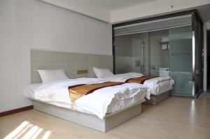 A bed or beds in a room at Juli Boutique Hotel