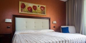 Voodi või voodid majutusasutuse Hotel Flora toas