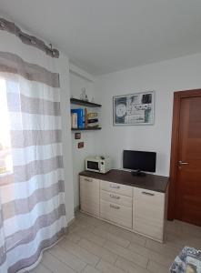 TV a/nebo společenská místnost v ubytování Chiocciola del Parco