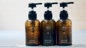 a group of three bottles sitting next to each other at Via Inn Shin Osaka in Osaka