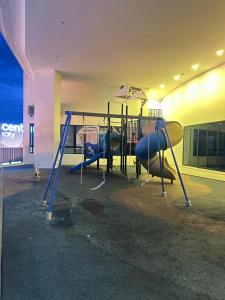 a playground in a building with two swings at ISOHO ICITY FREE PARKING WIFI By 4G in Shah Alam