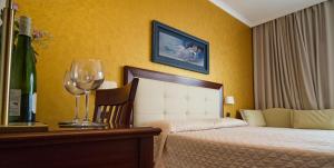 Voodi või voodid majutusasutuse Hotel Flora toas