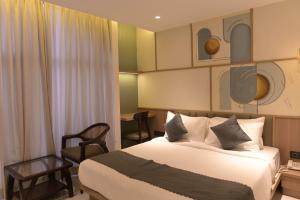 Ένα ή περισσότερα κρεβάτια σε δωμάτιο στο Hotel Varshish Inn