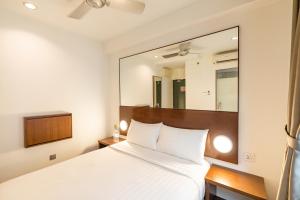 Postel nebo postele na pokoji v ubytování Tune Hotel Georgetown Penang