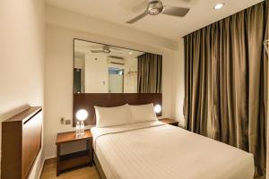 Postel nebo postele na pokoji v ubytování Tune Hotel Georgetown Penang