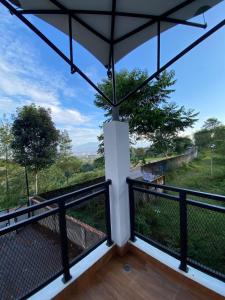 a view from the balcony of a house at Asaan homestay in Ciburial