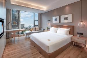 Postel nebo postele na pokoji v ubytování Yunjian Hotel