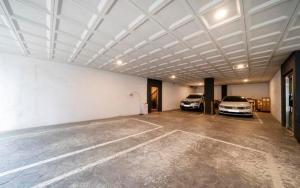 a garage with two old cars parked in it at Lounge Seoul in Icheon