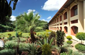 a building with a garden in front of it at M'kango Golfview Hotel in Lusaka