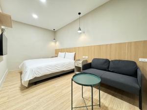 Ένα ή περισσότερα κρεβάτια σε δωμάτιο στο Yoshi Hotel - Tainan Sinmei Branch