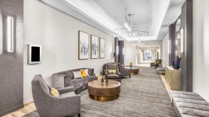 a living room with couches and chairs and a table at Hyatt House Houston Medical Center in Houston