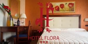 Voodi või voodid majutusasutuse Hotel Flora toas