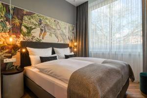 Postel nebo postele na pokoji v ubytování Vienna House Easy by Wyndham Hamburg Bergedorf