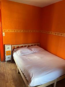 Postel nebo postele na pokoji v ubytování L'Hôtel du Mouton blanc
