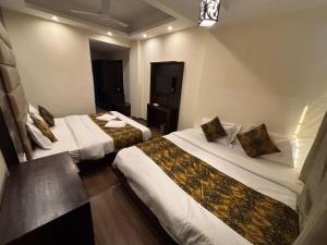 Letto o letti in una camera di The Bunkk Inn Hotel & Restaurant