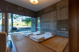 Postel nebo postele na pokoji v ubytování Chuying Sunrise B&B