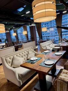 a dining room with a table and chairs at Arda Plaza Hotel in Tashkent