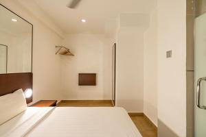 Postel nebo postele na pokoji v ubytování Tune Hotel Georgetown Penang