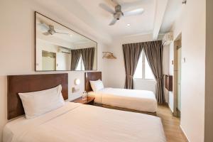 Postel nebo postele na pokoji v ubytování Tune Hotel Georgetown Penang + 23 fotografií