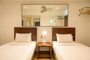 Postel nebo postele na pokoji v ubytování Tune Hotel Georgetown Penang