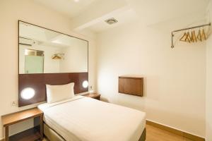 Postel nebo postele na pokoji v ubytování Tune Hotel Georgetown Penang