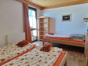 Postel nebo postele na pokoji v ubytování Apartmány Ester