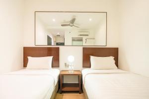 Postel nebo postele na pokoji v ubytování Tune Hotel Georgetown Penang