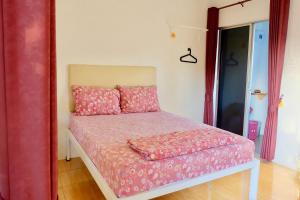 Postel nebo postele na pokoji v ubytování Ruai Thong Pong Pai Resort