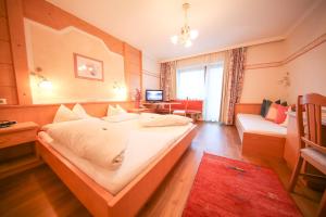Ein Bett oder Betten in einem Zimmer der Unterkunft Superior Hotel Persal