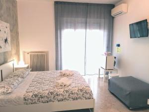 Postel nebo postele na pokoji v ubytování Tanzi Home