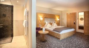 Postel nebo postele na pokoji v ubytování Hotel Stern