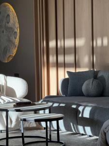 a living room with a couch and a table at The View Villas in Ferizaj