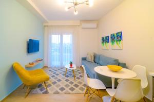 a living room with a couch and a table at Eternal Suites Edessa in Edessa