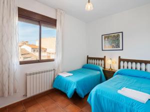 a bedroom with two beds and a window at Casa Rural La Bienservida in Bienservida +67 photos