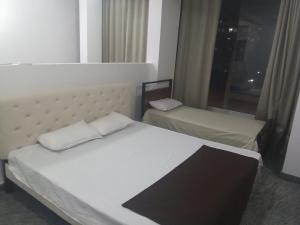 Ένα ή περισσότερα κρεβάτια σε δωμάτιο στο Hotel Comfort Stay +10 φωτογραφίες