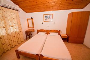Postel nebo postele na pokoji v ubytování Amalia Studios Skiathos + 5 fotografií