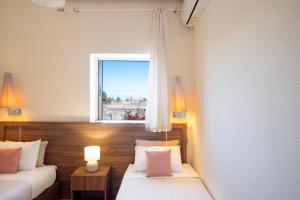 Posteľ alebo postele v izbe v ubytovaní Irini Apartment II
