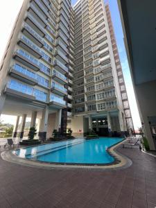 a large apartment building with a large swimming pool at Apartment Pelita Batam Floor 21 no 5 Studio with Balcony in Nagoya
