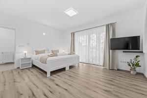 Posteľ alebo postele v izbe v ubytovaní Apartment AnaKatarina
