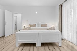 Posteľ alebo postele v izbe v ubytovaní Apartment AnaKatarina