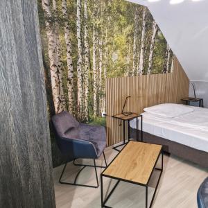 Postel nebo postele na pokoji v ubytování Jarzębinowy Resort & SPA