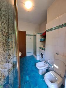 a bathroom with a toilet and a sink and a shower at Ca di Nà in Entracque +23 photos