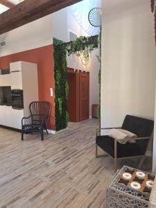 a living room with a couch and a table at Le Loft du Centre Ville in Aix-les-Bains