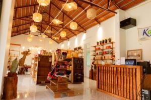 a room with a store with lots of furniture and lights at Kolia Resort in Cao Bằng