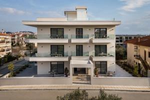 an aerial view of a white building at Dimi Residence in Nea Moudania