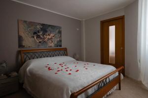Ένα ή περισσότερα κρεβάτια σε δωμάτιο στο Toni Rosa House - Cozy Apartment - Molfetta